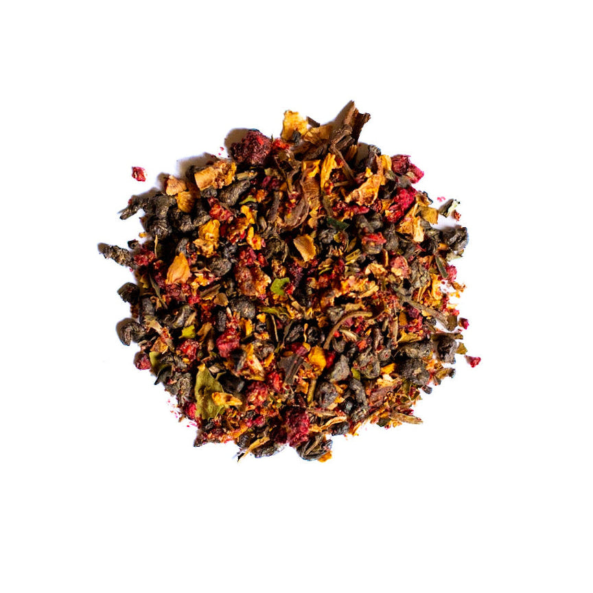 Colorful dried fruit and tea on a white background